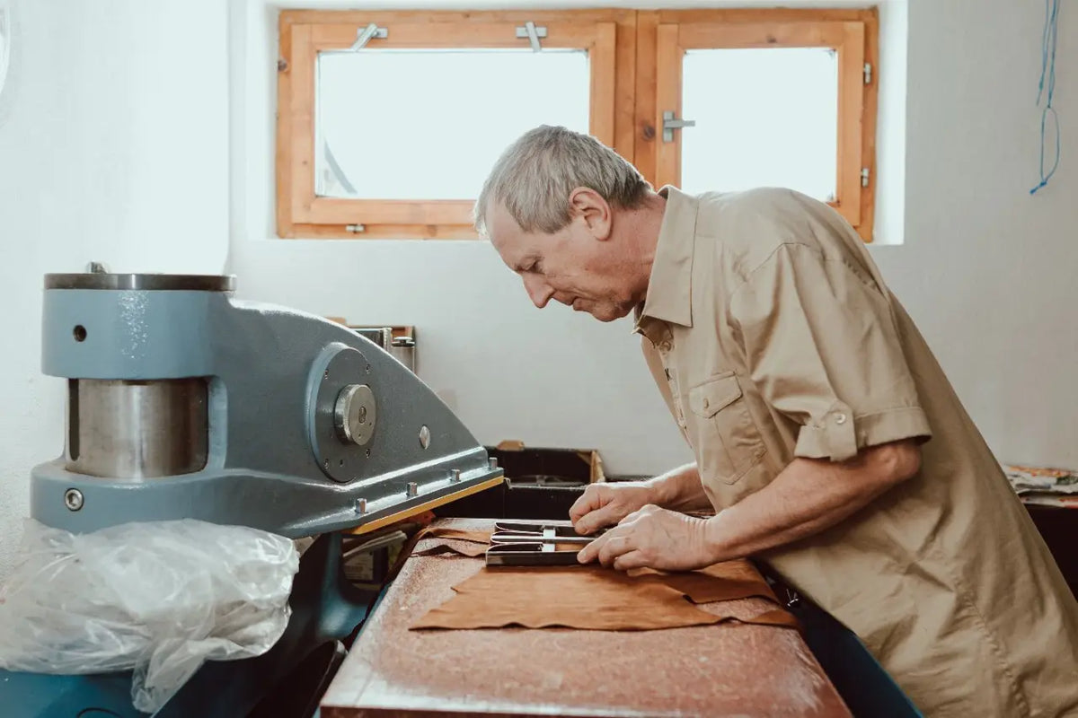 Václav working with leather in the family workshop