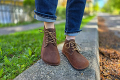 Brown LUKS Barefoot shoes worn outdoors