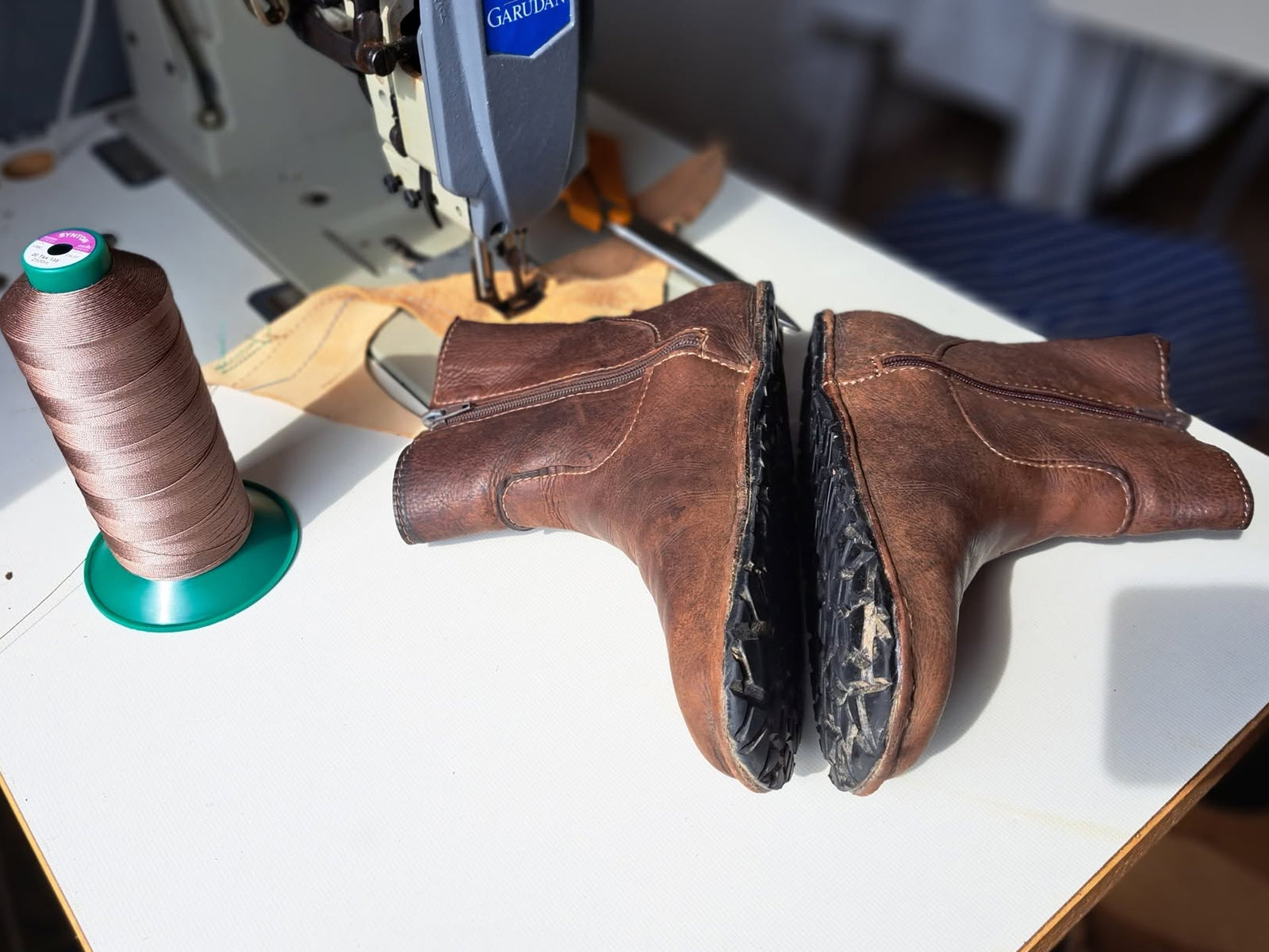 Four-year-old LUKS boots showing their sole and construction