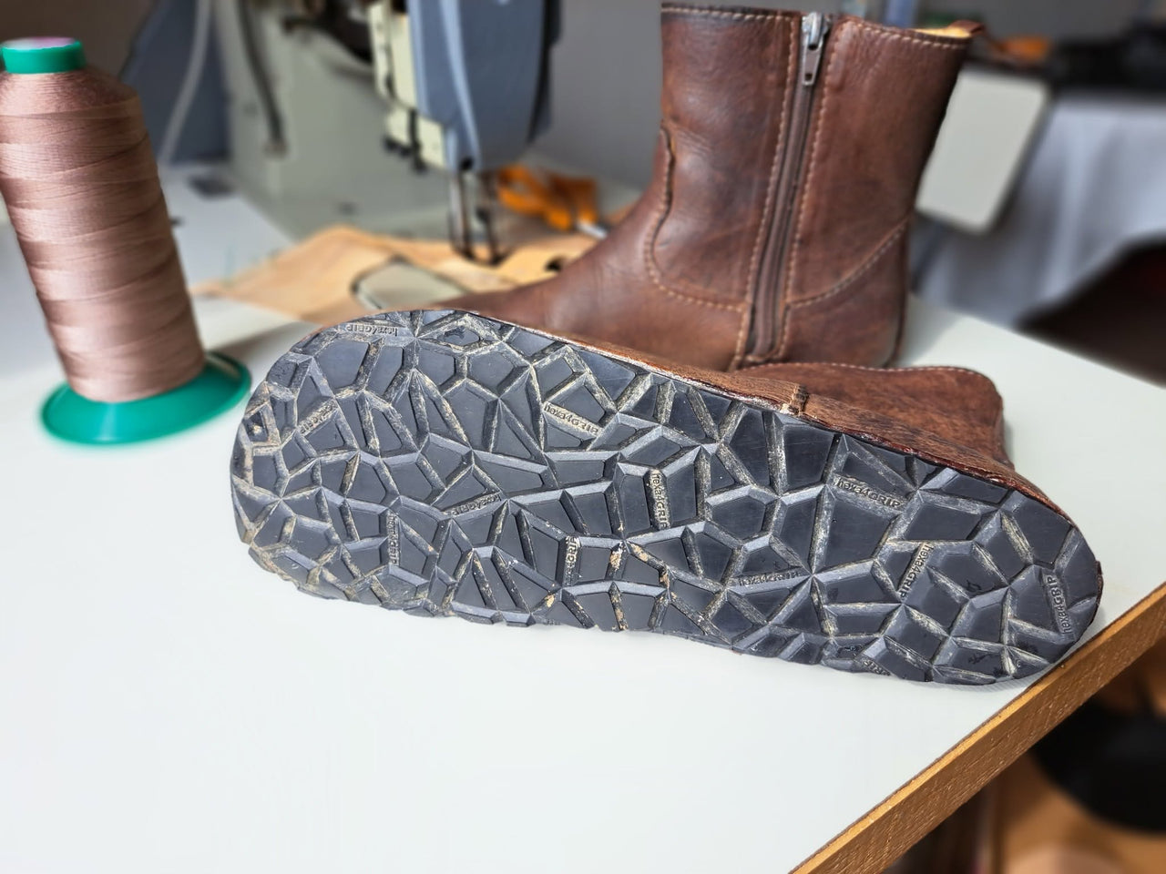 A real customer's four-year-old LUKS boots in the family workshop